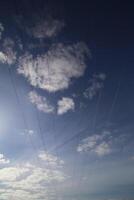 Cables on high voltage power line on a dark blue sky with cloudscape photo