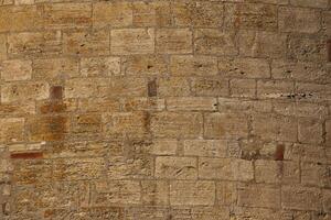 Convex wall made from freestones usable as background or texture photo