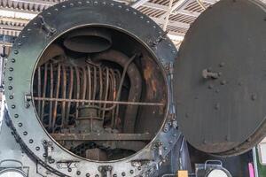 A close up of a train engine with a large open door photo