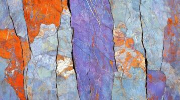 Abstract Colorful Cracked Rock Surface Texture Vibrant Orange Purple and Blue Stone Background photo