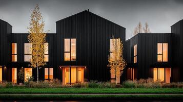 Modern Black Townhouses at Dusk Illuminated Windows Autumnal Landscape photo