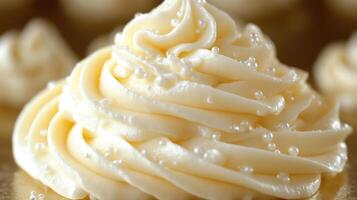 Delicate frosting swirls enhance an elegant dessert display with sparkling sugar pearls photo