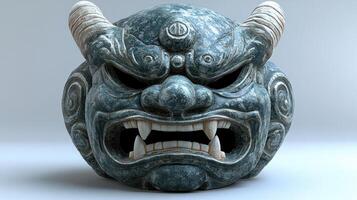A beautifully crafted guardian mask made of stone displays a powerful expression and artistry photo