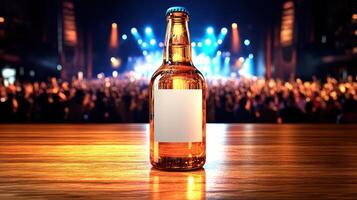 A cold beverage rests on a wooden table while an enthusiastic crowd enjoys live music photo