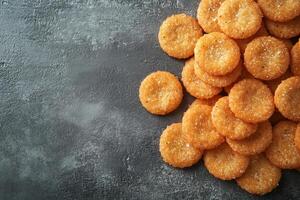 Crunchy round snacks piled on dark background for national nutrition month copy space photo