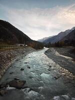 River arve flowing through chamonix valley in autumn photo