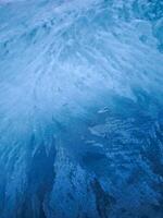 Frozen window showing intricate ice crystals forming in chamonix, france photo
