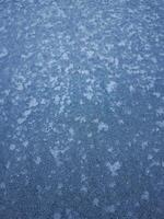 Frozen surface showing intricate ice crystals in chamonix, france photo