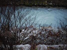 River arve flowing through chamonix in autumn photo
