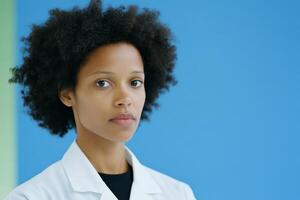 Confident Female Scientist in Lab Coat Against Blue Background photo