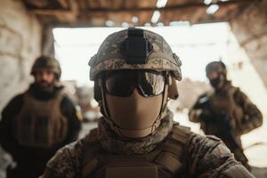 Military personnel in tactical gear pose for a group portrait in a war-torn building during a training exercise at sunrise photo