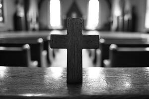 A wooden cross stands prominently on a pew in a serene church setting, bathed in soft light from stained glass windows photo