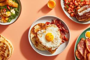 Delicious breakfast spread featuring bacon, eggs, toast, and fresh fruit salad on a colorful tabletop photo