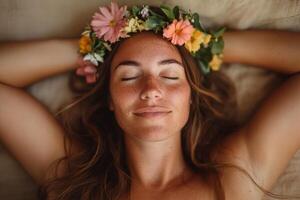 Woman with flower crown relaxes on a soft surface, enjoying a peaceful moment of serenity in nature during daylight photo