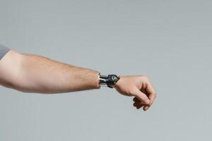 A hand with a prosthetic arm demonstrating modern technology in everyday life photo