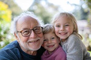 Grandfather enjoying a joyful moment with his two grandchildren outdoors during a sunny afternoon photo