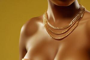 Elegant display of layered gold chains against a vibrant yellow background, highlighting the beauty of jewelry and skin photo