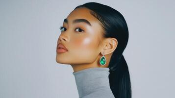 Portrait of a stylish woman with emerald earring showcasing elegance and beauty. photo