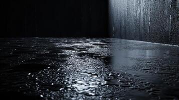 Wet reflective surface in dark room with texture and shadow play photo