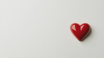Red heart shaped object on white background for love and romance concept photo