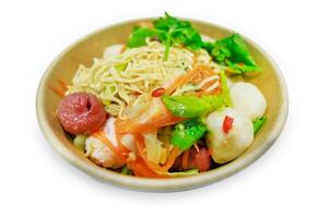 Top view of noodle spicy salad with Crab stick Sausage, focus selective photo