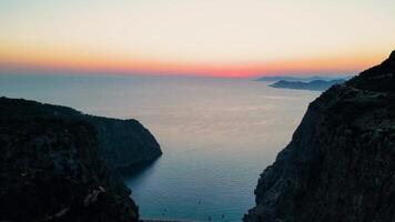 Amazing Sunset at sea from the rocky shore. Sunset at sea. silhouette of Rocky slope in the foreground. video