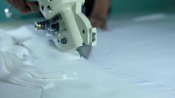 Slow motion of fabric cutting with manual fabric cutting machine video
