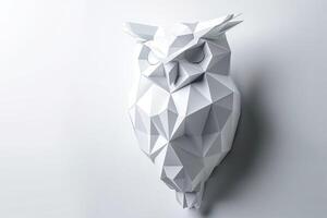 White owl made of paper with a triangular shape photo