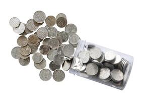 Counting coin in jar isolated photo
