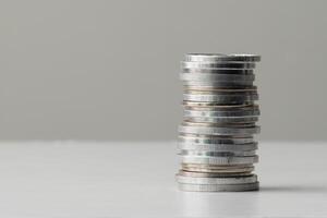 Stack of coins on the table copy space photo
