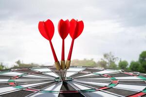 three dart on target with sunrise light photo