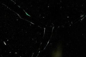Grunge broken glass with particle texture photo