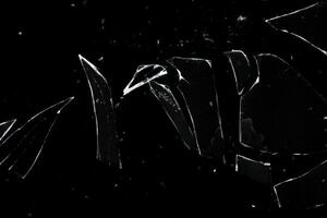 Sharp broken glass texture with particle and dust overlay photo