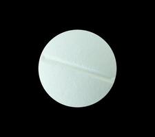 Round white pill isolated. pharmacy concept element photo