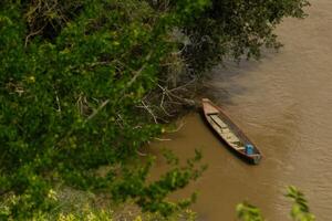 Canoe Moored on a Riverbank photo