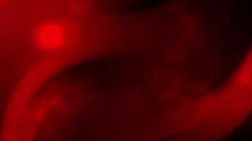 Red blurred curves blend into dark shadowy areas. Suitable for backgrounds, abstract designs, artistic projects, digital art, and promotional materials. video