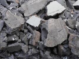 Broken concrete wall in the construction site, closeup of photo