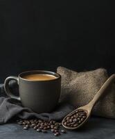cup of coffee and some brown coffee beans photo