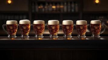 Glasses of beer on a wooden table in a pub or restaurant photo