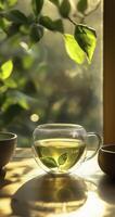 glass cup of green tea on table photo