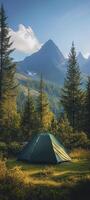 green tent in grass surrounded by trees photo
