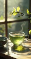 a glass cup of green tea on the table photo