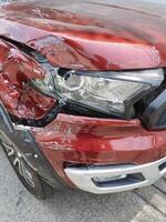 broken headlight after accident on road photo