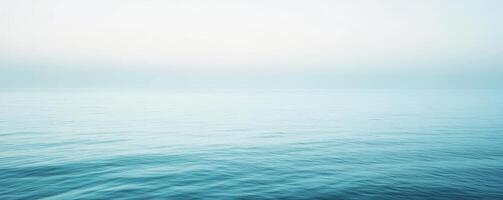 Calm ocean horizon with gentle waves under clear sky photo