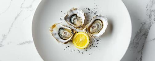 plate with fresh oysters and lemon on marble table, gourmet seafood dining concept photo