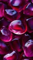 Close-up of shiny purple pomegranate seeds photo