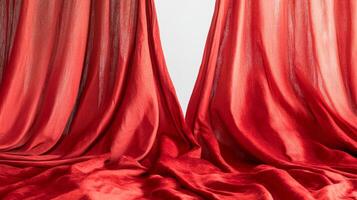 Elegant red silk curtains with soft folds in a studio setting, fabric and textile design concept photo