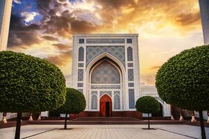 modern Islamic white Masjid Minor Mosque in Tashkent in Uzbekistan on background of sunset sky in spring photo