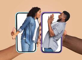 African American couple engages in an animated discussion using their smartphones, showing intense emotions. photo