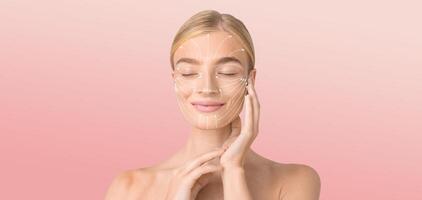 A woman is pampering herself with a skin care routine, gently applying a product to her face. The background is soft and isolated, perfect for a moment of relaxation and self-care. photo